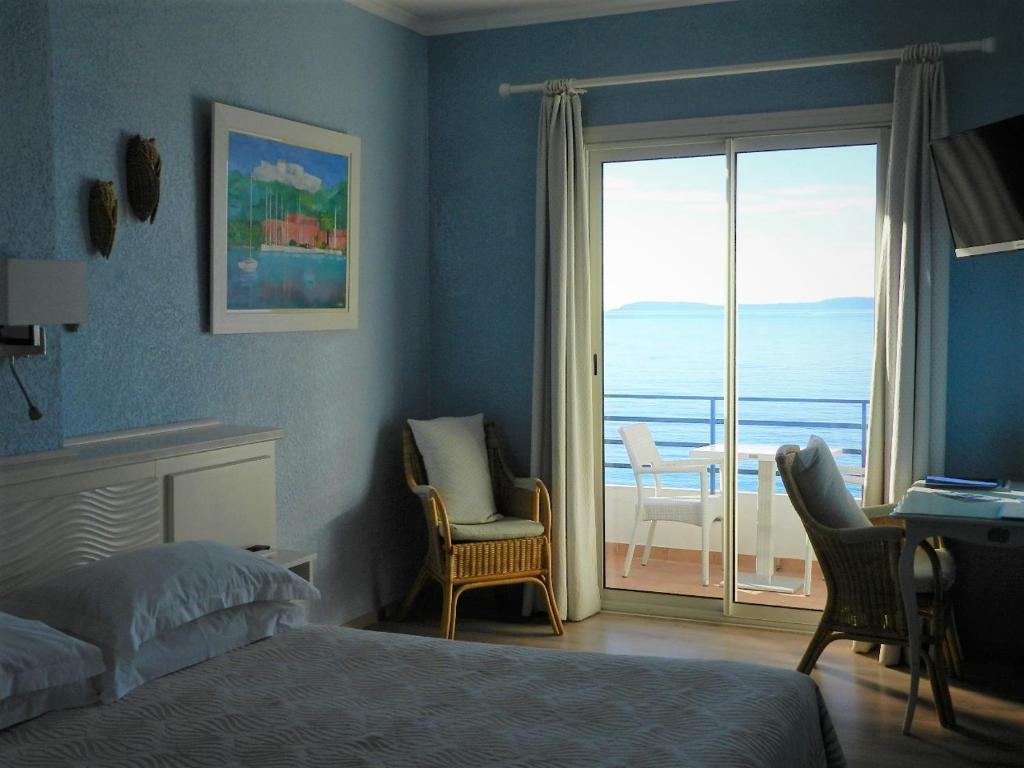 Postel nebo postele na pokoji v ubytování Grand Hotel Moriaz
