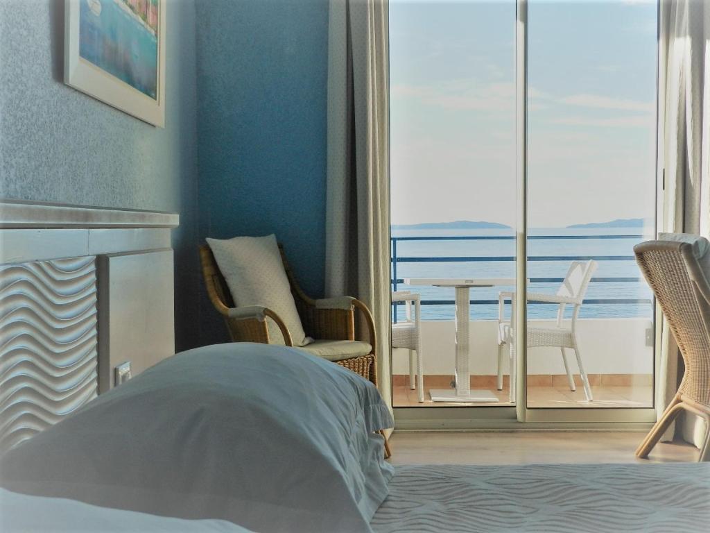 Postel nebo postele na pokoji v ubytování Grand Hotel Moriaz