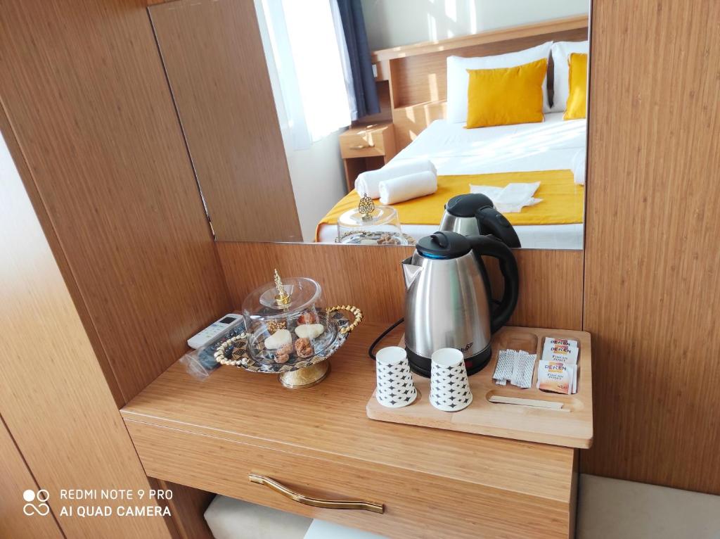 a room with a bed and a tea kettle on a table at Lebon Hotel-Special Class in Istanbul