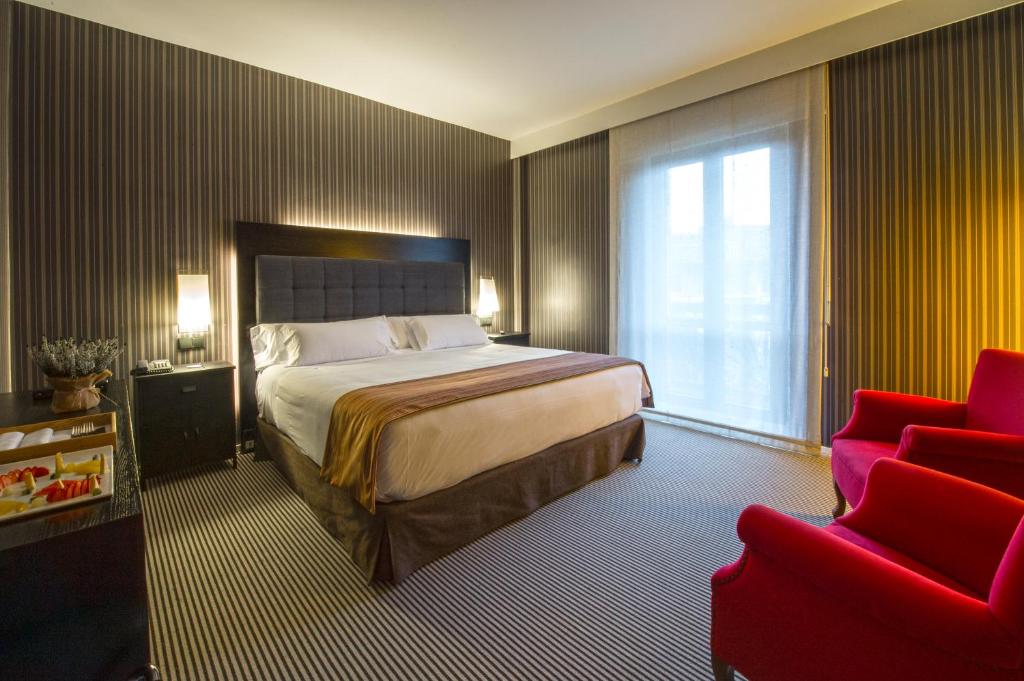 Postel nebo postele na pokoji v ubytování Silken Gran hotel Durango