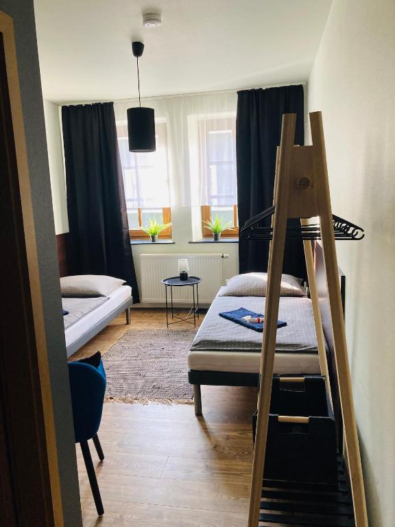 Postel nebo postele na pokoji v ubytování Pension Boulevard