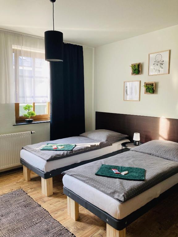 Postel nebo postele na pokoji v ubytování Pension Boulevard