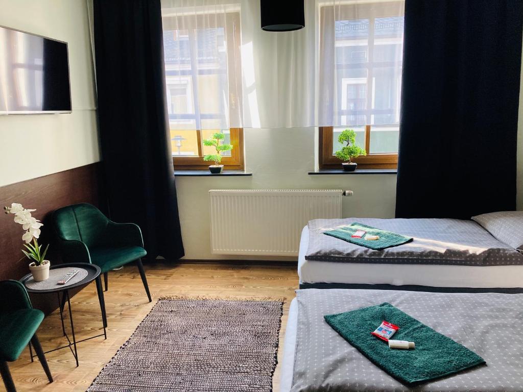 Postel nebo postele na pokoji v ubytování Pension Boulevard