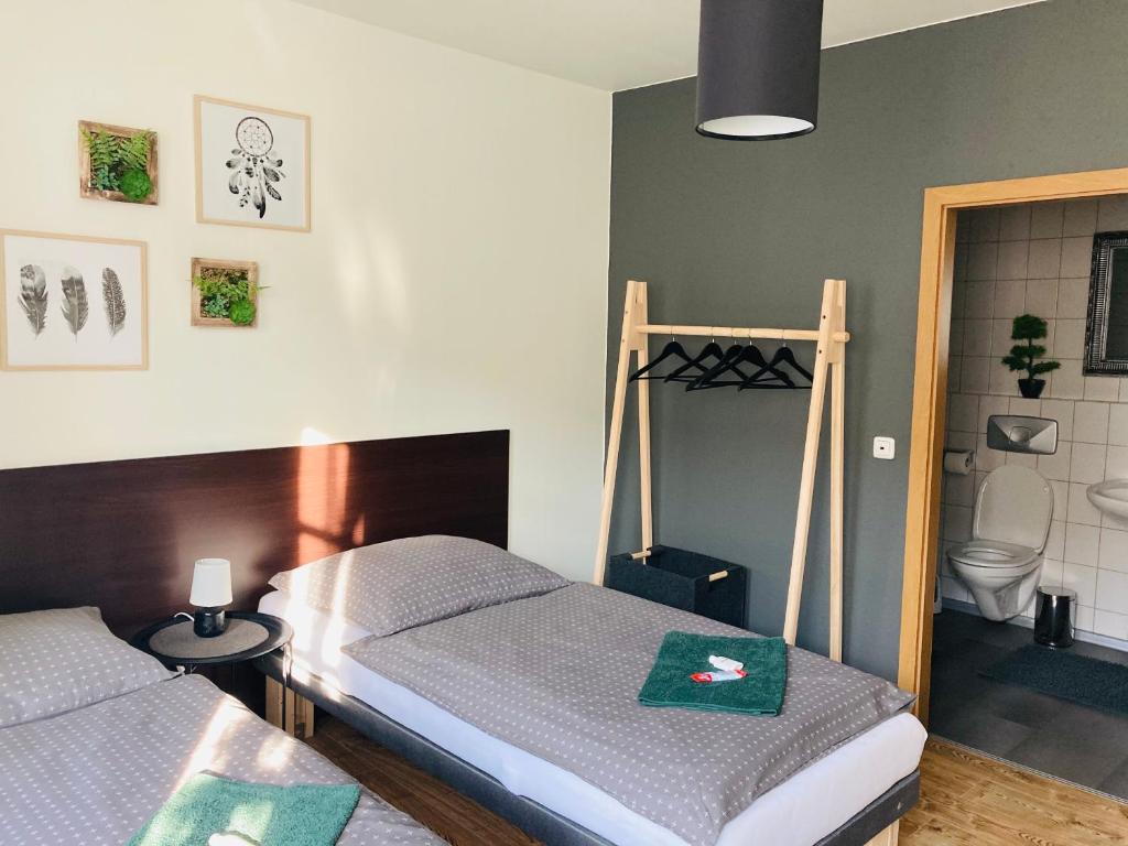 Postel nebo postele na pokoji v ubytování Pension Boulevard