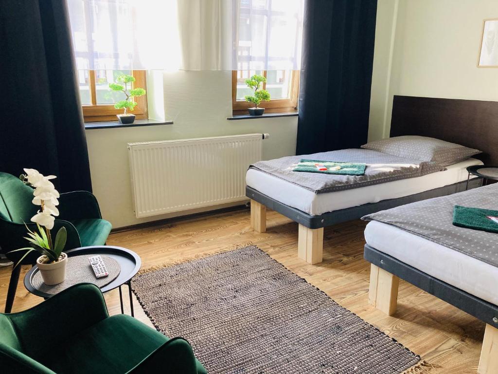 Postel nebo postele na pokoji v ubytování Pension Boulevard