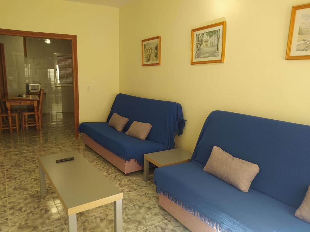 A seating area at apartamentos la villa 2