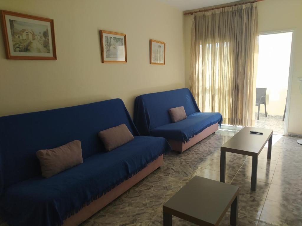 A seating area at apartamentos la villa 2