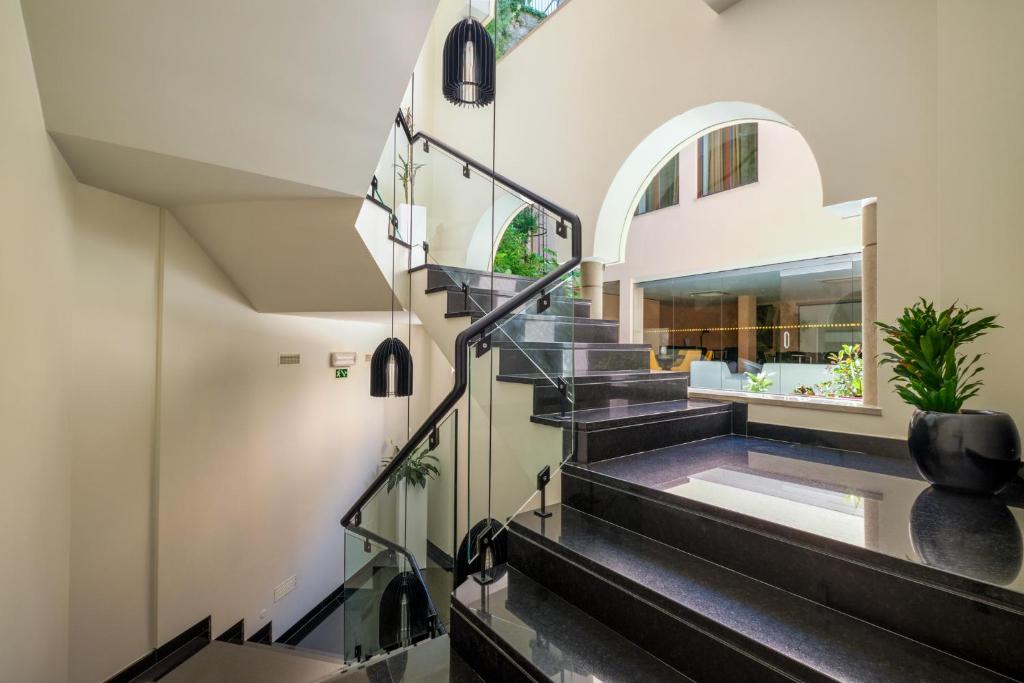 a staircase in a home with black and white at Sintra Boutique Hotel in Sintra