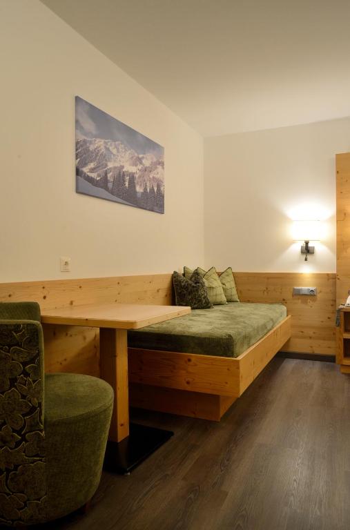 Postel nebo postele na pokoji v ubytování Hotel Platzl
