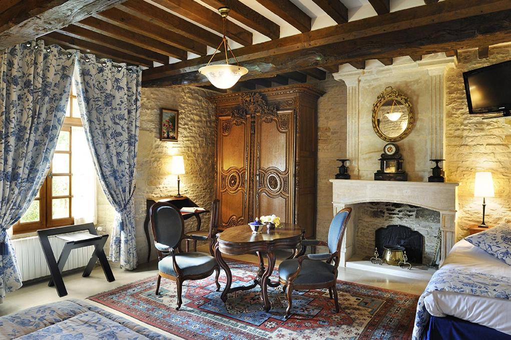 Posezení v ubytování Hôtel Le Manoir De Mathan Crépon à la campagne 5 mn d'Arromanches et 10 mn de Bayeux
