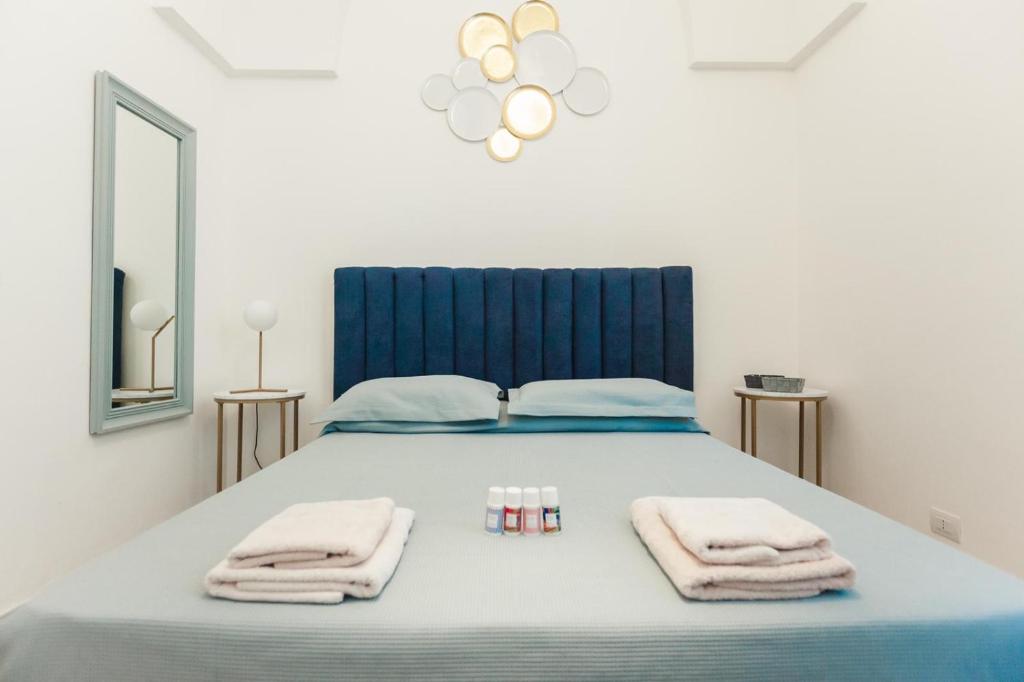 Postel nebo postele na pokoji v ubytování Terrazza in Piazza