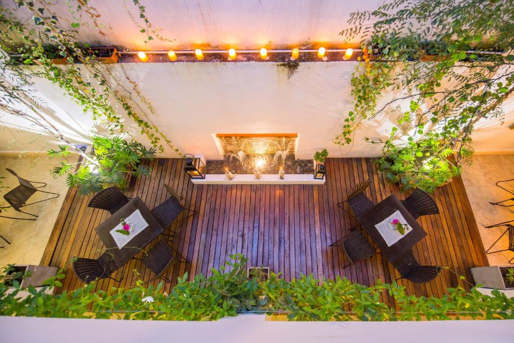 a stage with plants and lights on it at Leclerc Hotel Boutique Cali Granada in Cali