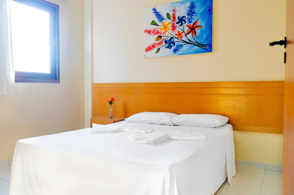Ένα ή περισσότερα κρεβάτια σε δωμάτιο στο Pousada Vale do Sul