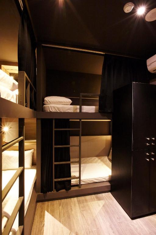 Postel nebo postele na pokoji v ubytování Main Inn Taipei