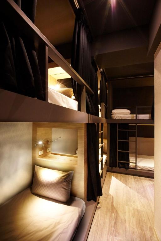 Postel nebo postele na pokoji v ubytování Main Inn Taipei