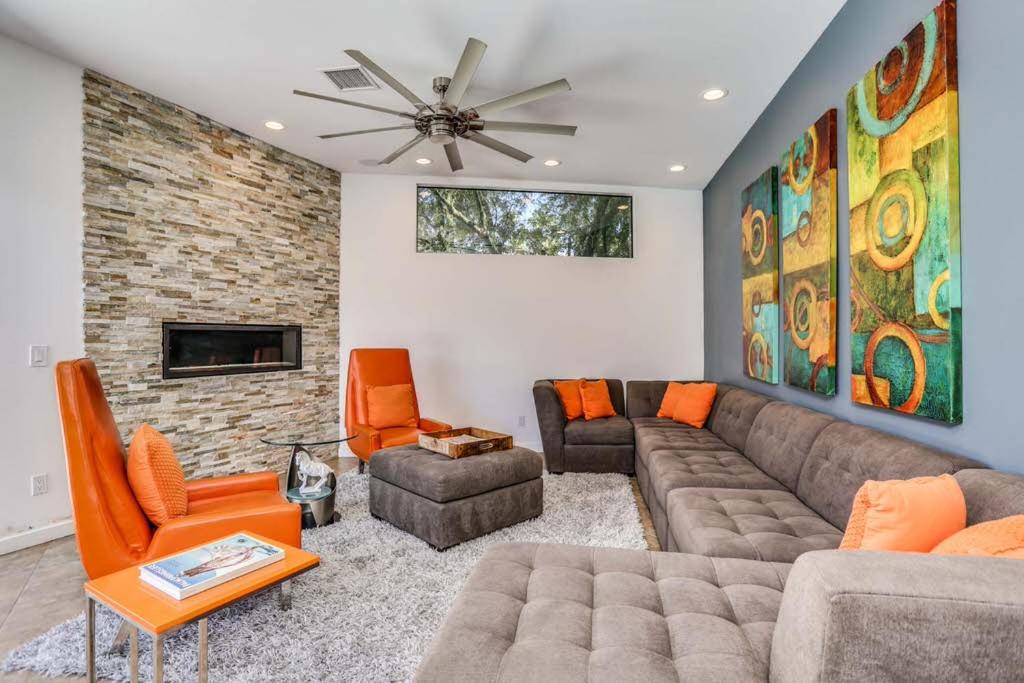 a living room with a couch and chairs and a fireplace at Tangerine Dream Permit# 2444 in Palm Springs