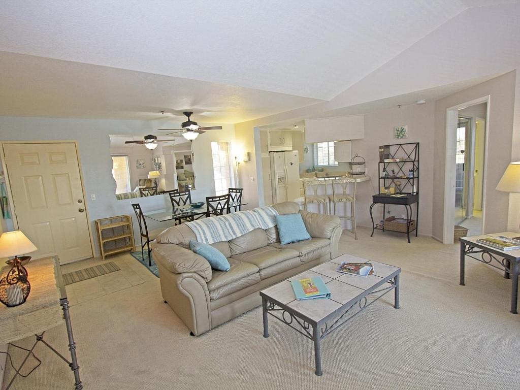 a living room with a couch and a table at Esprit Vacation Condo in Palm Springs