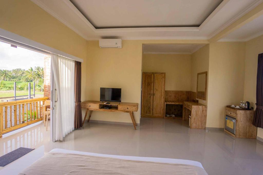 TV a/nebo společenská místnost v ubytování Sujiwa Ubud Retreat Villa