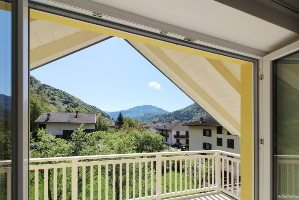 a balcony with a view of the mountains at La mansarda di Rossella in Pieve Di Ledro