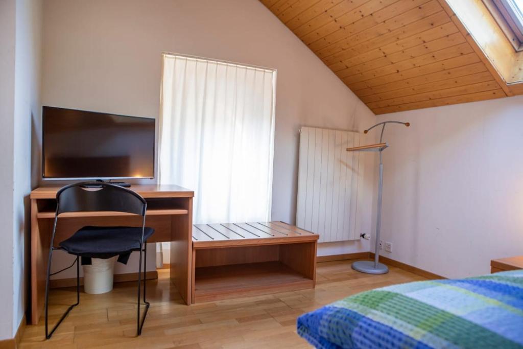 Postel nebo postele na pokoji v ubytování BB Garni Motta