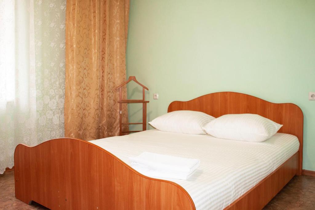 Ένα ή περισσότερα κρεβάτια σε δωμάτιο στο Apartment "Kvartirniy Vopros" on Stroiteley 8