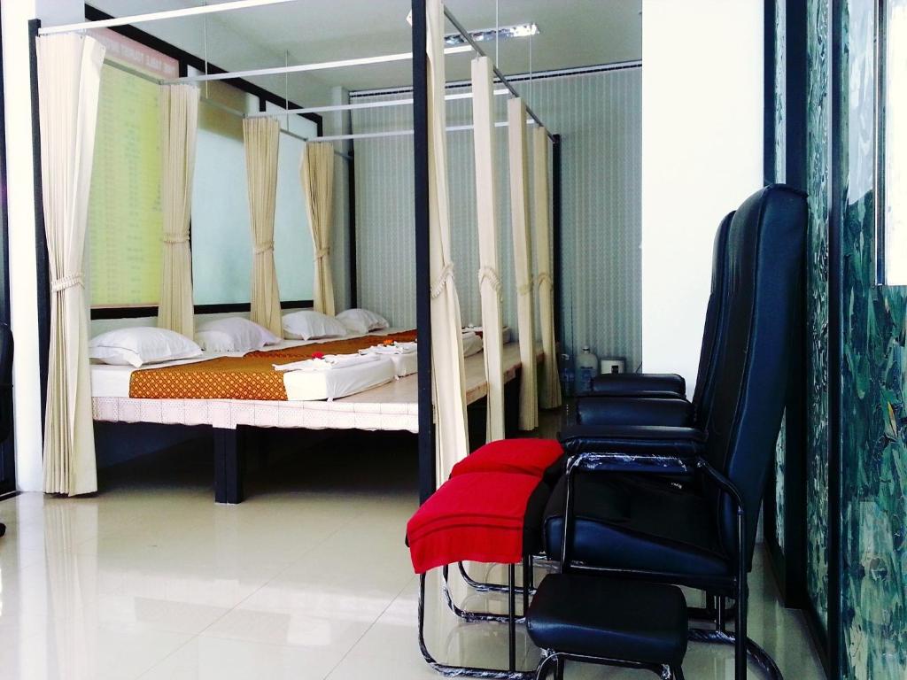 Postel nebo postele na pokoji v ubytování Lada Krabi Residence Hotel - SHA Plus