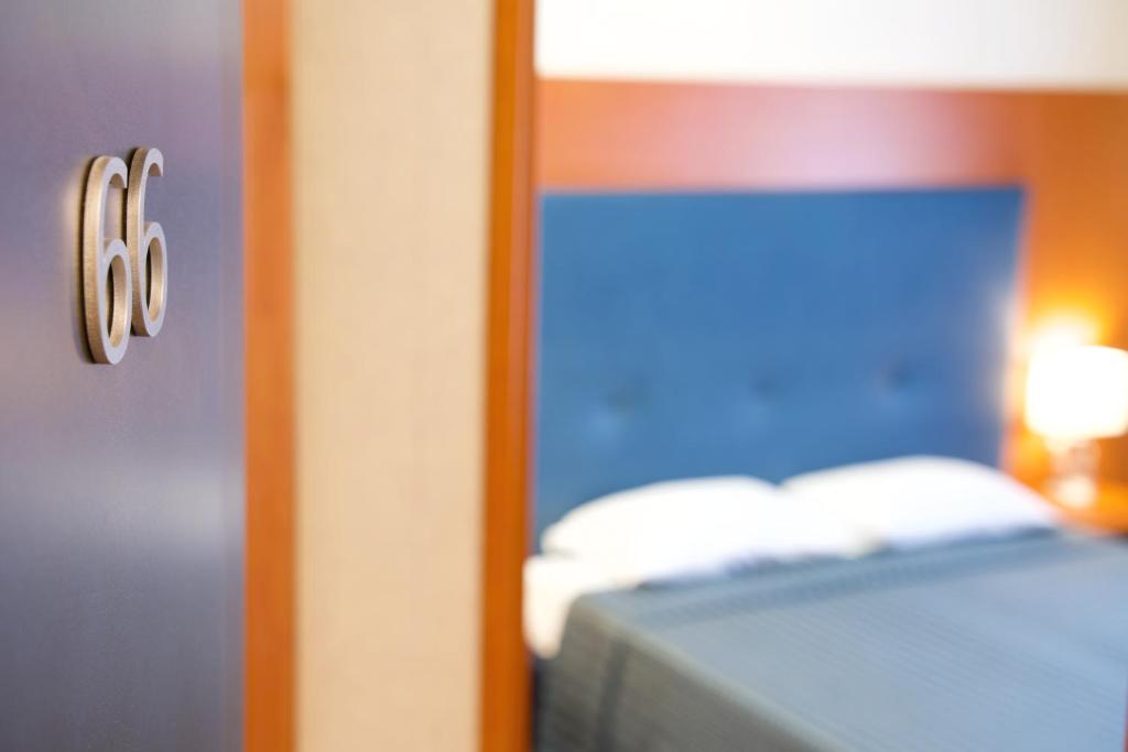 Łóżko lub łóżka w pokoju w obiekcie Hotel Mec
