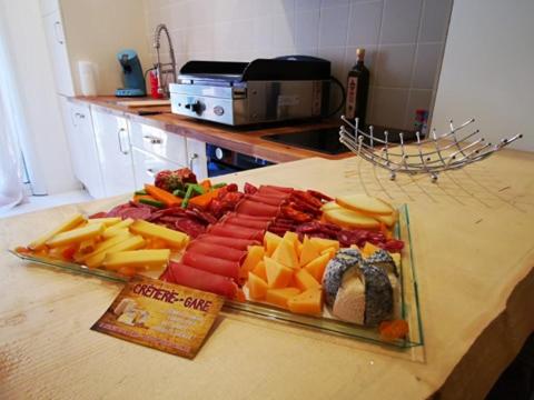 a tray of food on a counter with cheese and meats at Maison Small Luxury ( planxa,suite,solarium,jacuzzi,pas de vis à vis) in Argelès-sur-Mer