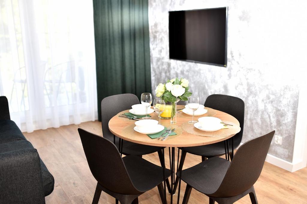 Televízia a/alebo spoločenská miestnosť v ubytovaní VIP Apartament number 8
