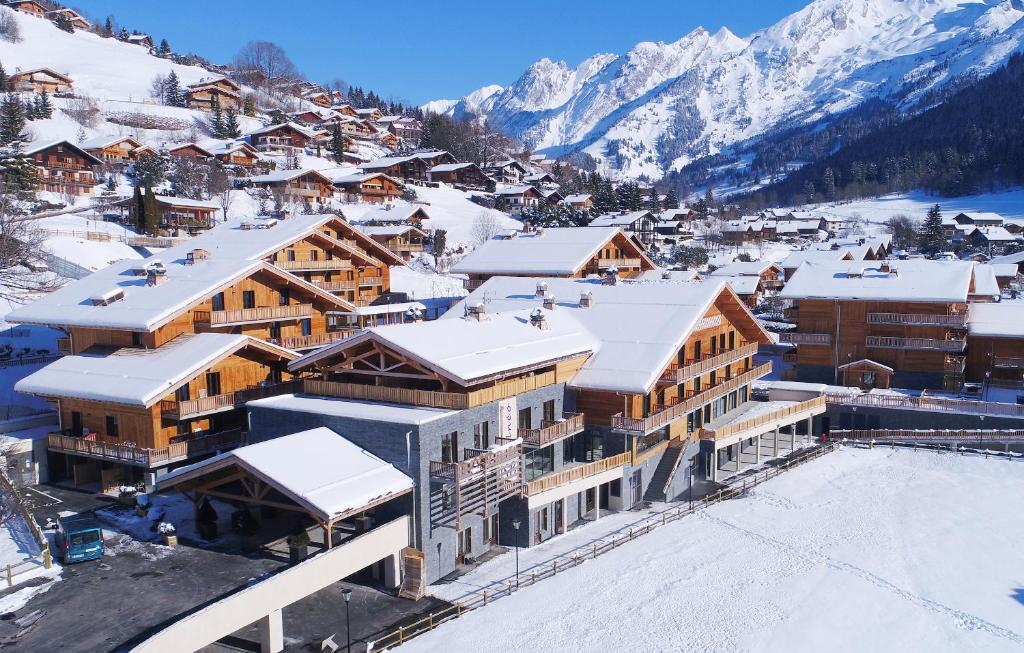 an aerial view of a ski resort in the snow at Hôtel Prestige Odalys Le Chamois in La Clusaz