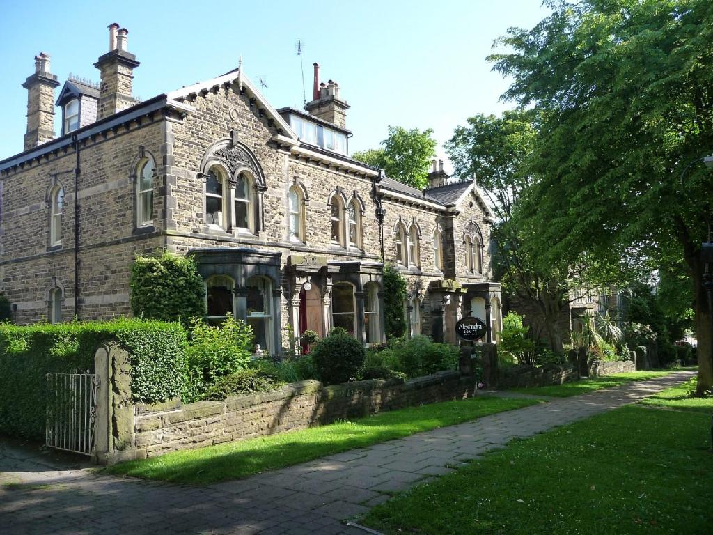 an old brick house with a path in front of it at Alexandra Court in Harrogate