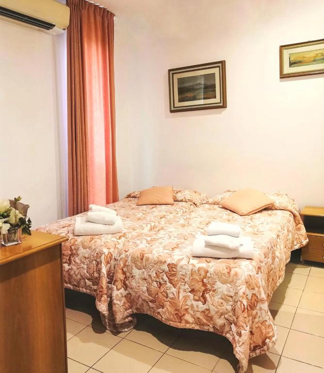 Postel nebo postele na pokoji v ubytování Hotel Europa