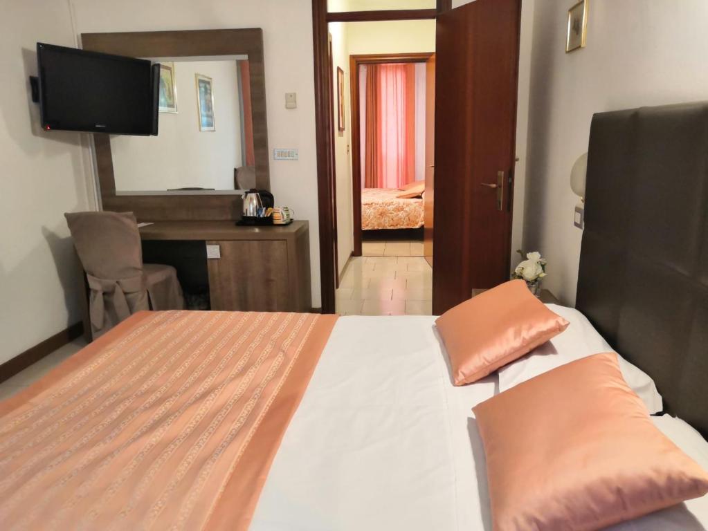 Postel nebo postele na pokoji v ubytování Hotel Europa