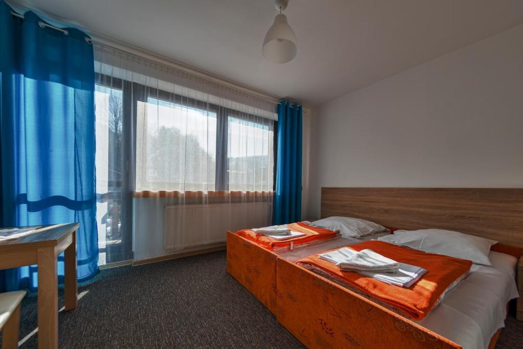 Postel nebo postele na pokoji v ubytování Ośrodek U Fojta