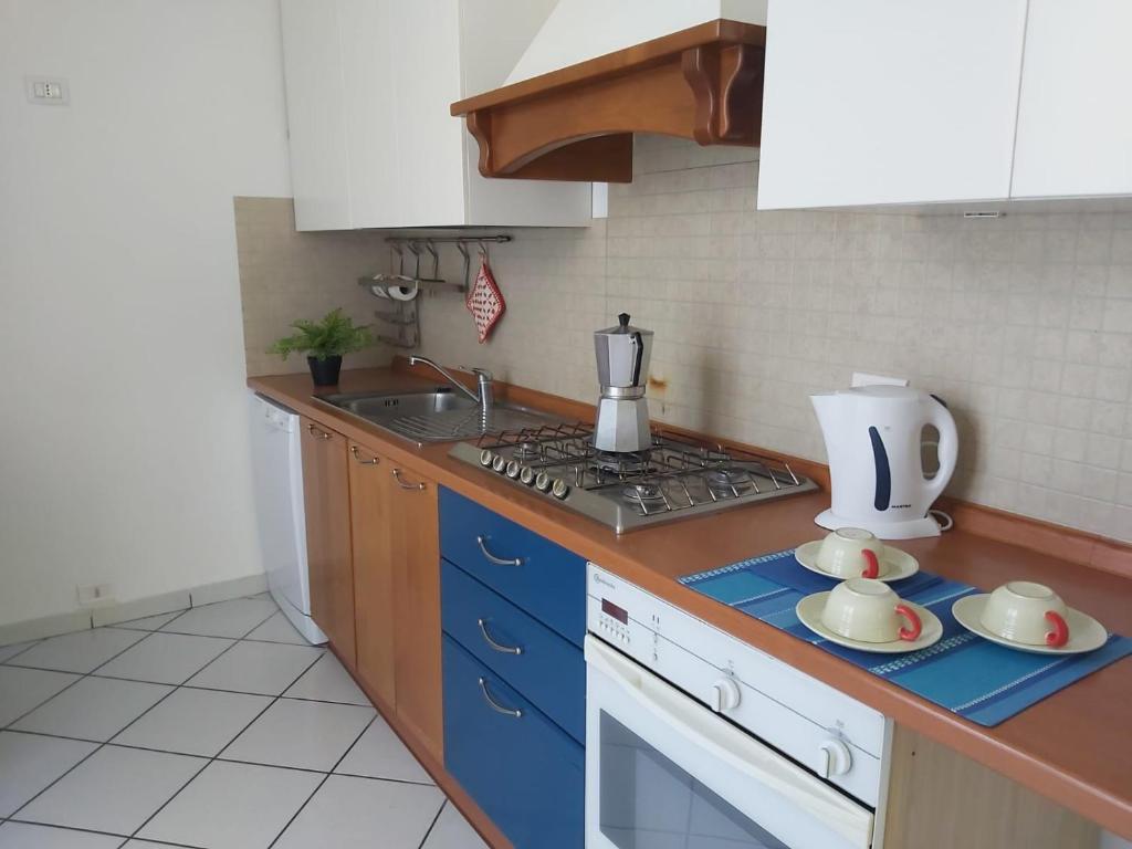 A kitchen or kitchenette at Bnbook Villa Biancospino