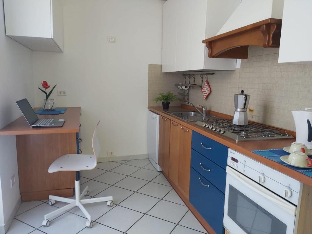 A kitchen or kitchenette at Bnbook Villa Biancospino