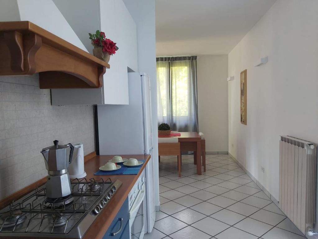 A kitchen or kitchenette at Bnbook Villa Biancospino