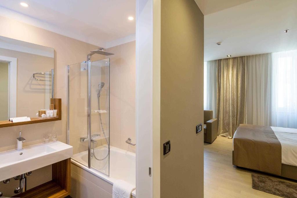 Kúpeľňa v ubytovaní Cornaro Hotel