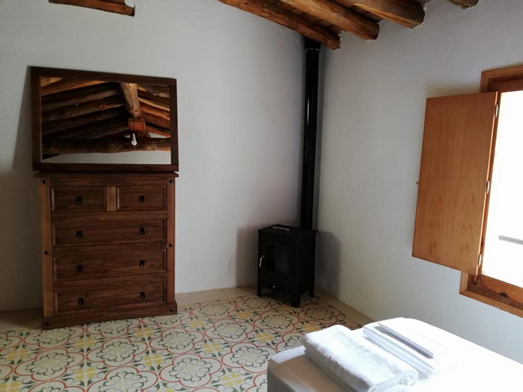 A bed or beds in a room at Casa Purujosa