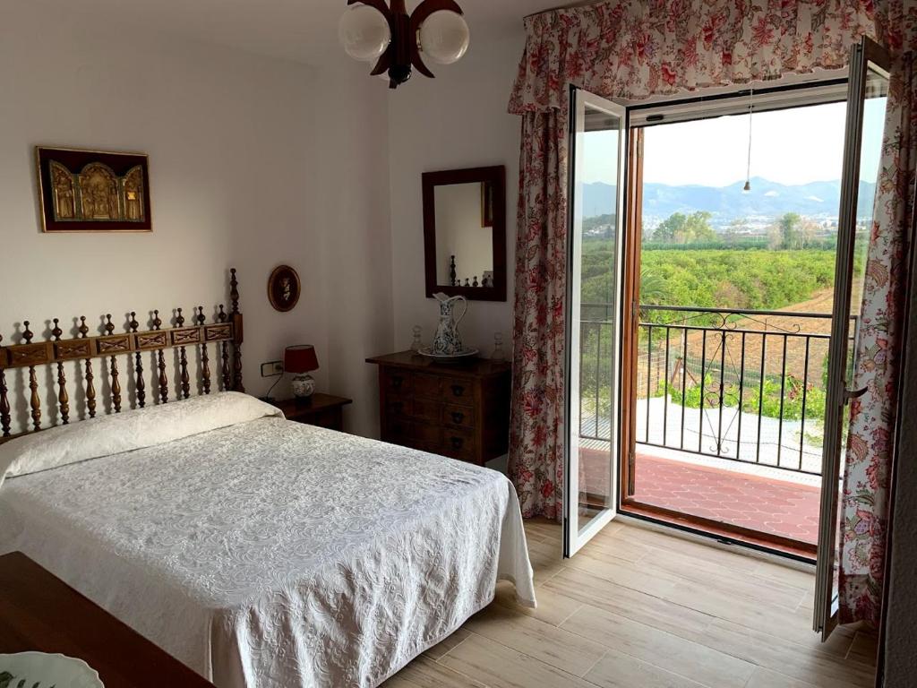 Posteľ alebo postele v izbe v ubytovaní Antigua Estación de Campanillas