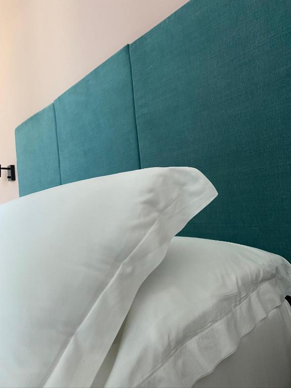Postel nebo postele na pokoji v ubytování Verdeaqua Rooms