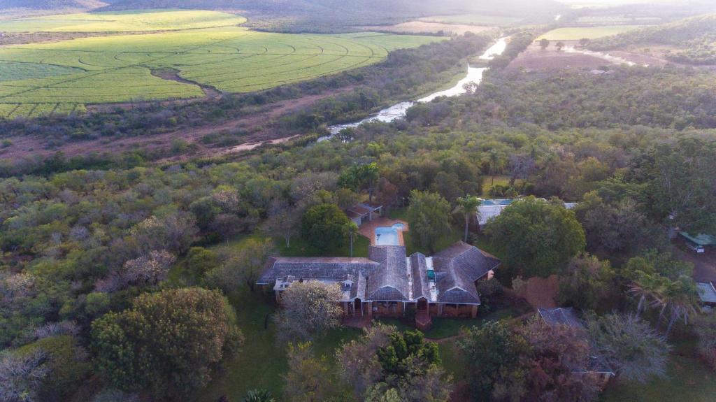 an aerial view of a house in a field at Tamboti Ridge Bed and Breakfast in Pongola Game Reserve