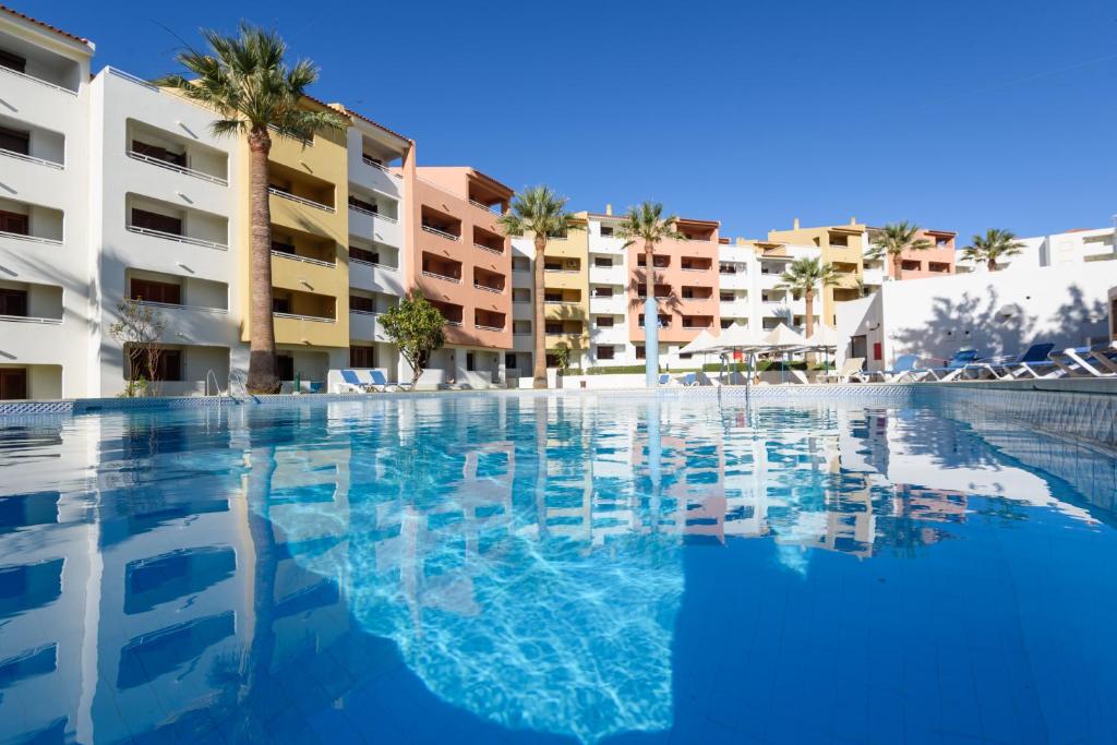 a large swimming pool in front of a building at Bellavista Avenida By BeGuest in Albufeira