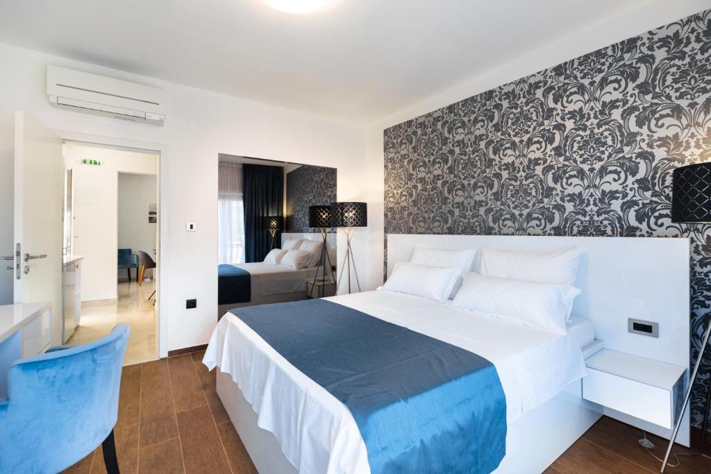 Posteľ alebo postele v izbe v ubytovaní WISH Apartments