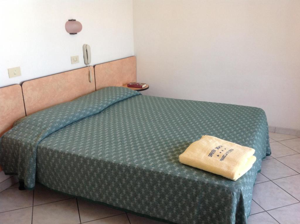 Postel nebo postele na pokoji v ubytování Hotel Casali