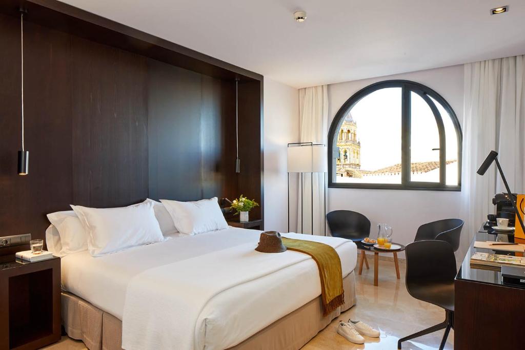 Postel nebo postele na pokoji v ubytování Hotel Posada del Lucero