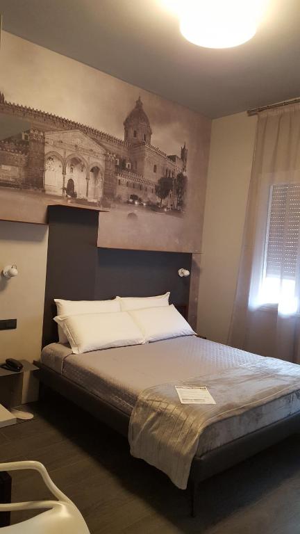 Postel nebo postele na pokoji v ubytování Alma Hotel