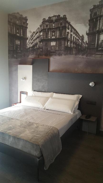 Postel nebo postele na pokoji v ubytování Alma Hotel