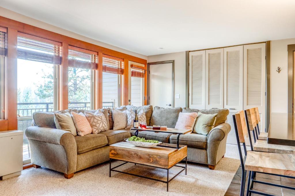 a living room with a couch and a table at Seventh Mountain in Bend