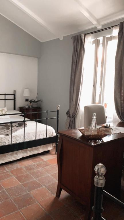 Łóżko lub łóżka w pokoju w obiekcie Gioia House